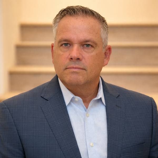 Professional headshot with navy blazer